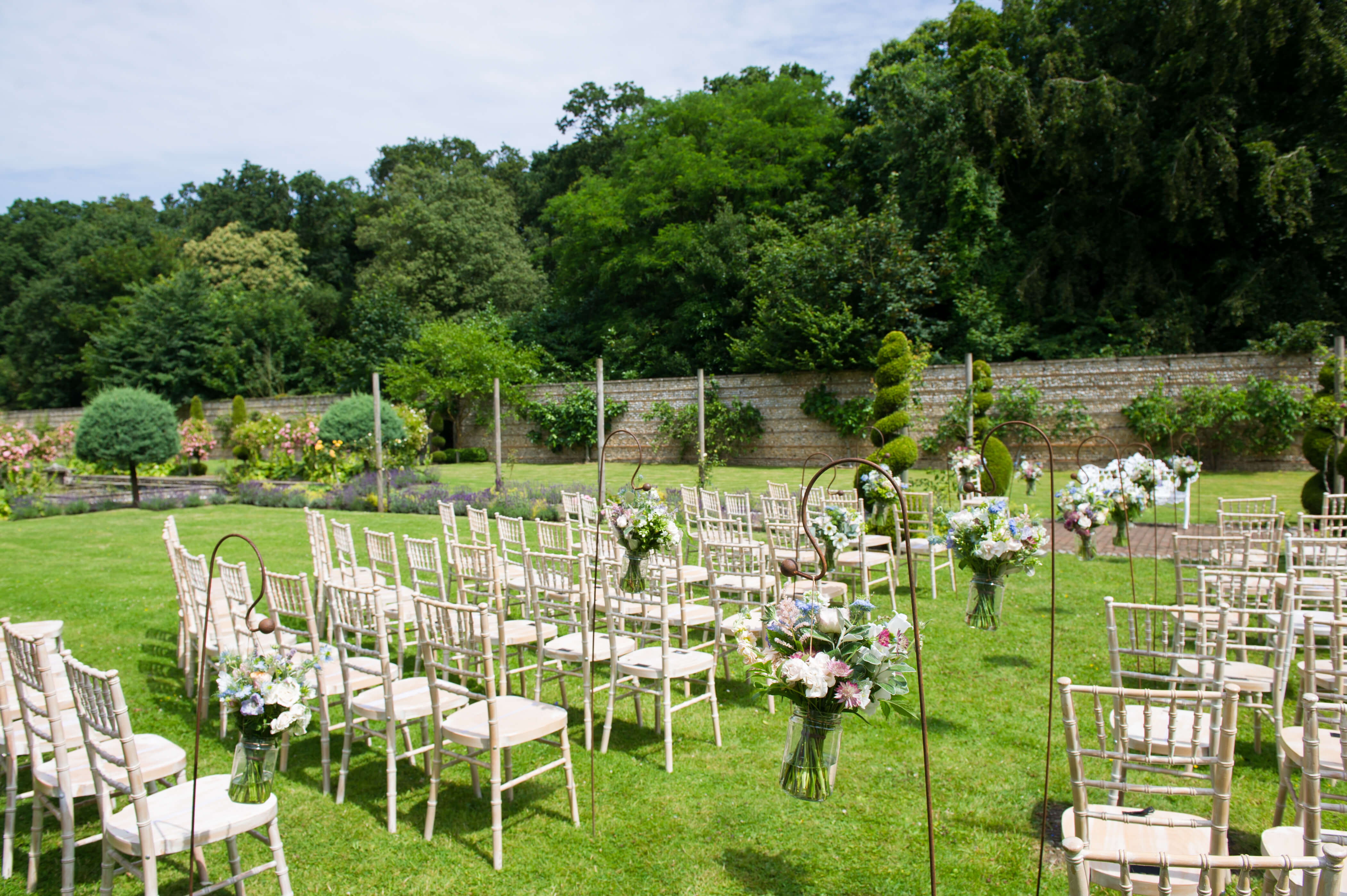 Chairs laid out ready for a wedding in the gardens of Voewood House 